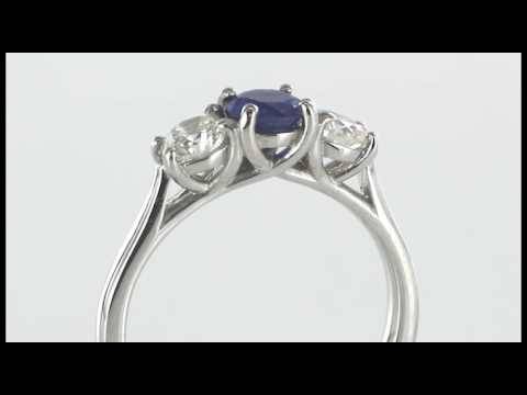 Modern Round Diamond and Blue Sapphire Trilogy Ring